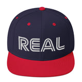 REAL By.. JA'NERIK The Brand Snapback Hat