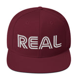 REAL By.. JA'NERIK The Brand Snapback Hat