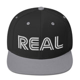 REAL By.. JA'NERIK The Brand Snapback Hat