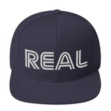 REAL By.. JA'NERIK The Brand Snapback Hat